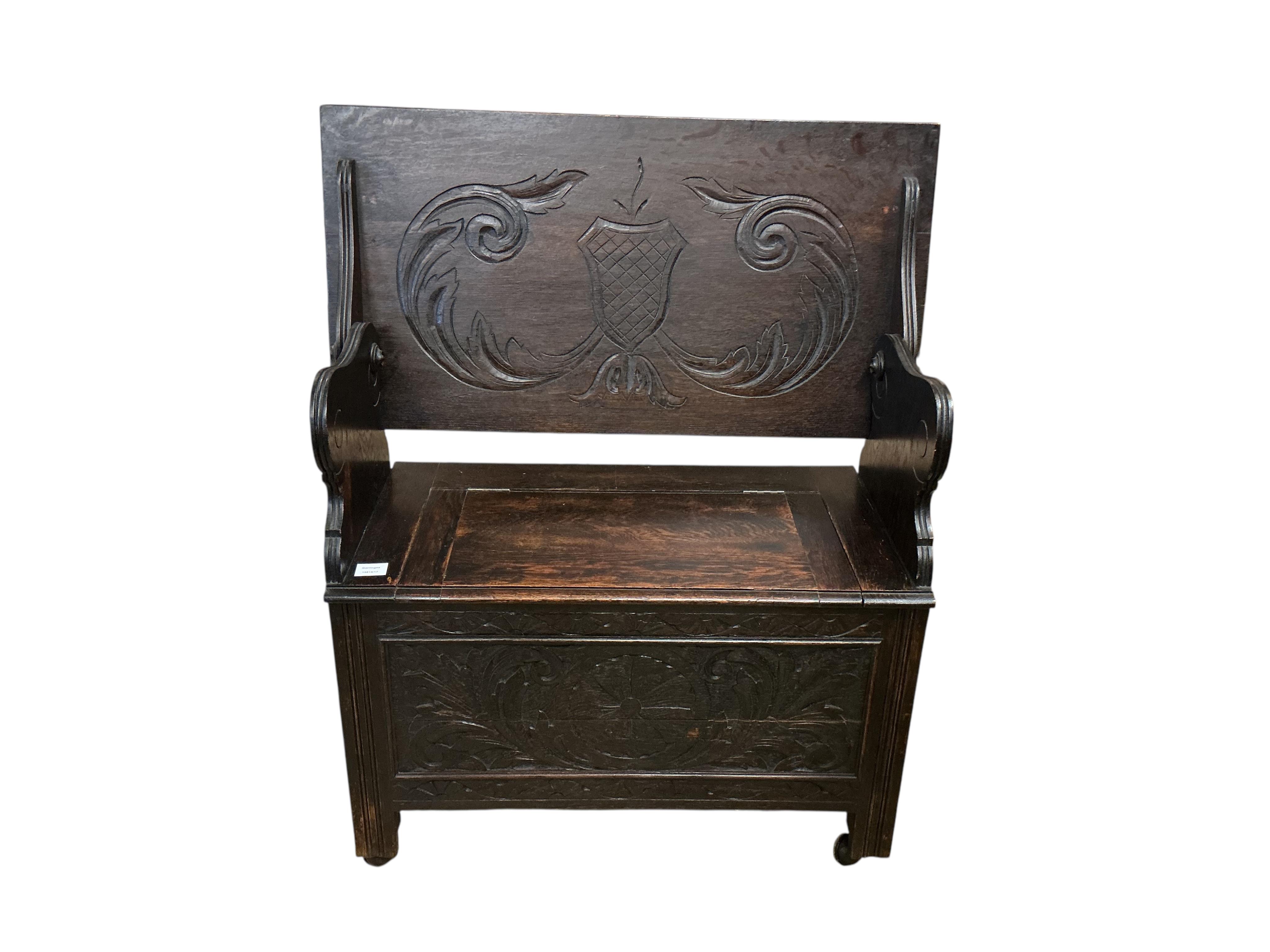 A small 1920's oak monk's bench, width 91cm, depth 46cm, height 106cm